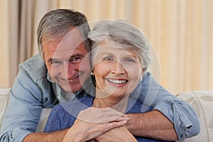 Mature man hugging his wife