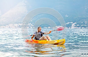 Mature man kayaking on the sea
