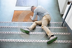 Mature Man Lying On Staircase