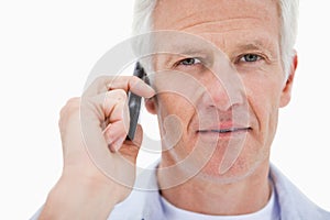 Mature man making a phone call