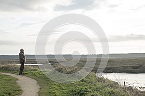 Mature man outdoors standing on a path