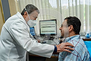 Mature man performing pulmonary function test and spirometry