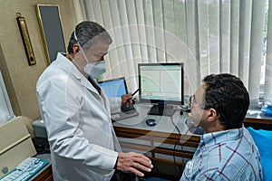 Mature man performing pulmonary function test and spirometry