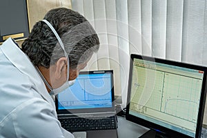 Mature man performing pulmonary function test and spirometry