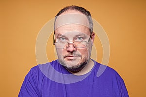 Mature man with reading glasses