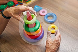 Mature man recovering motor skills in clinic