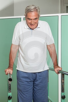 Mature man rehabilitating his legs photo