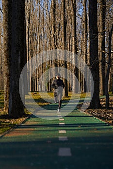 Mature man running in the park with headphones