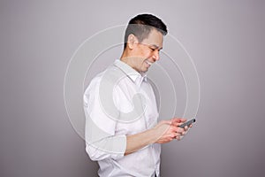 Mature man smiling with a mobile phone