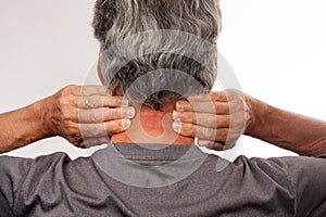 Mature Man stretching back of neck for pain relief