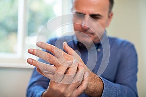 Mature Man Suffering With Repetitive Strain Injury