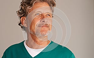 Mature man, thinking and smile in studio, peace and memory to remember on brown background. Happy male person, positive
