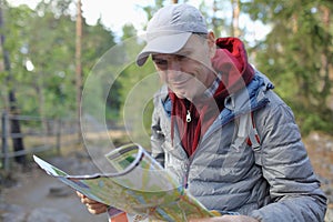 Mature man with a tourist map outdoors