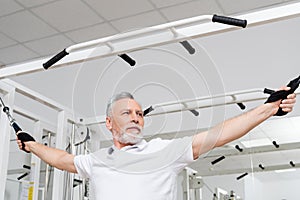 mature man training on pull rope