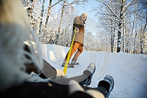 Mature Man Tugging Sleigh photo