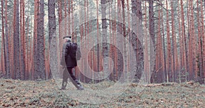 Mature man walking in the forest