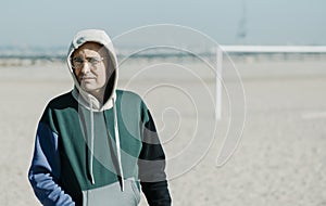 Mature man wearing a multicolored hoodie