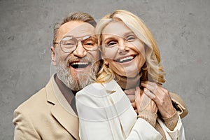 A mature man and woman elegantly