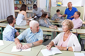 Mature man and woman talking during exam