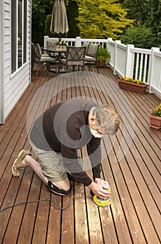 Mature man working on Natural Cedar Deck