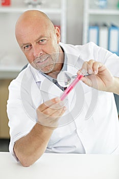 mature man working with quality tests