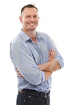 Mature masculinity. A handsome mature man smiling at the camera against a white background.