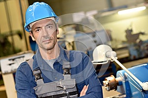 Mature metal worker in metallurgic industry