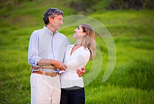 Mature middle age couple in love hugging