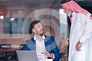 Mature Middle Eastern businessman wearing ghoutra in meeting photo