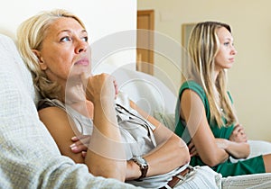 Mature mother and daughter having quarrel