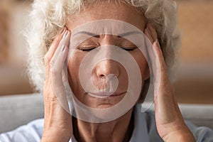 Mature old lady suffer from migraine at home