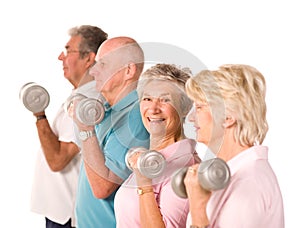 Mature older people lifting weights