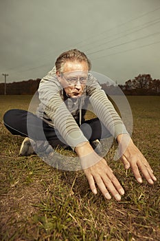 Mature older ugly man in glasses trying to be fitness icon