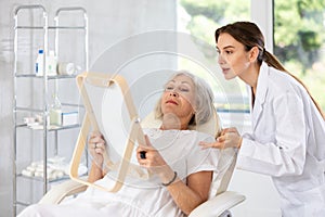 Mature patient with mirror