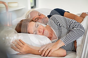 Mature couple sleeping together