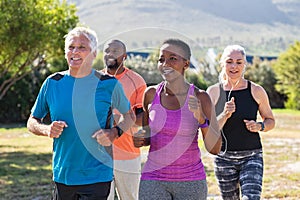 Mature and senior people jogging at park