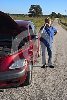 Mature Senior Woman Car Trouble, Road Breakdown photo