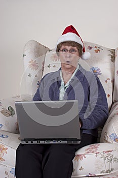 Mature Senior Woman Christmas Laptop Santa Hat