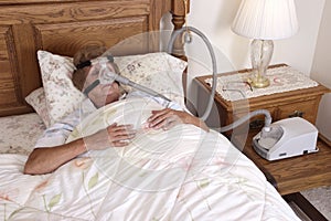 Mature Senior Woman CPAP Sleep Apnea Machine