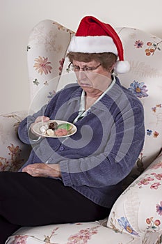 Mature Senior Woman Eating Holidays Cookies, Snack photo