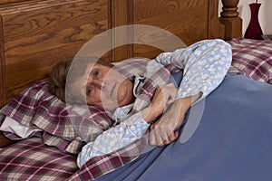 Mature Senior Woman Invalid Sick in Bed photo