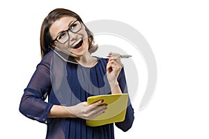 Mature smiling woman talking on the phone with notebook and pen in hand, female writes in notebook. White background isolated