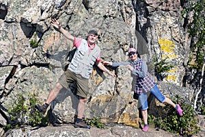 A mature sports couple on the top of Aleksandrovskaya Sopka mountain near the town of Zlatoust in the Chelyabinsk region