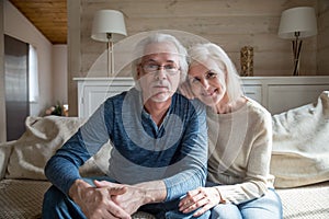 Mature spouses make video call looking at camera