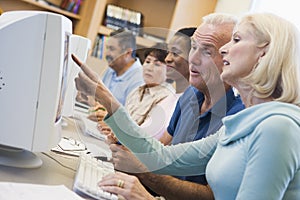 Mature students learning computer skills