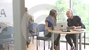 Mature Students Working In College Breakout Area