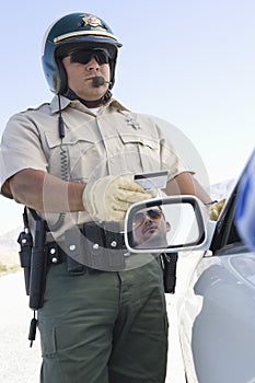 Mature Traffic Cop Holding License