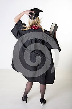 Mature university student wearing cap and gown