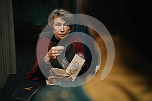 Mature witch spell for client using witchcraft book and magic pendulum