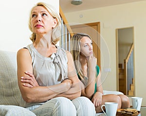 Mature woman and adult daughter having quarrel